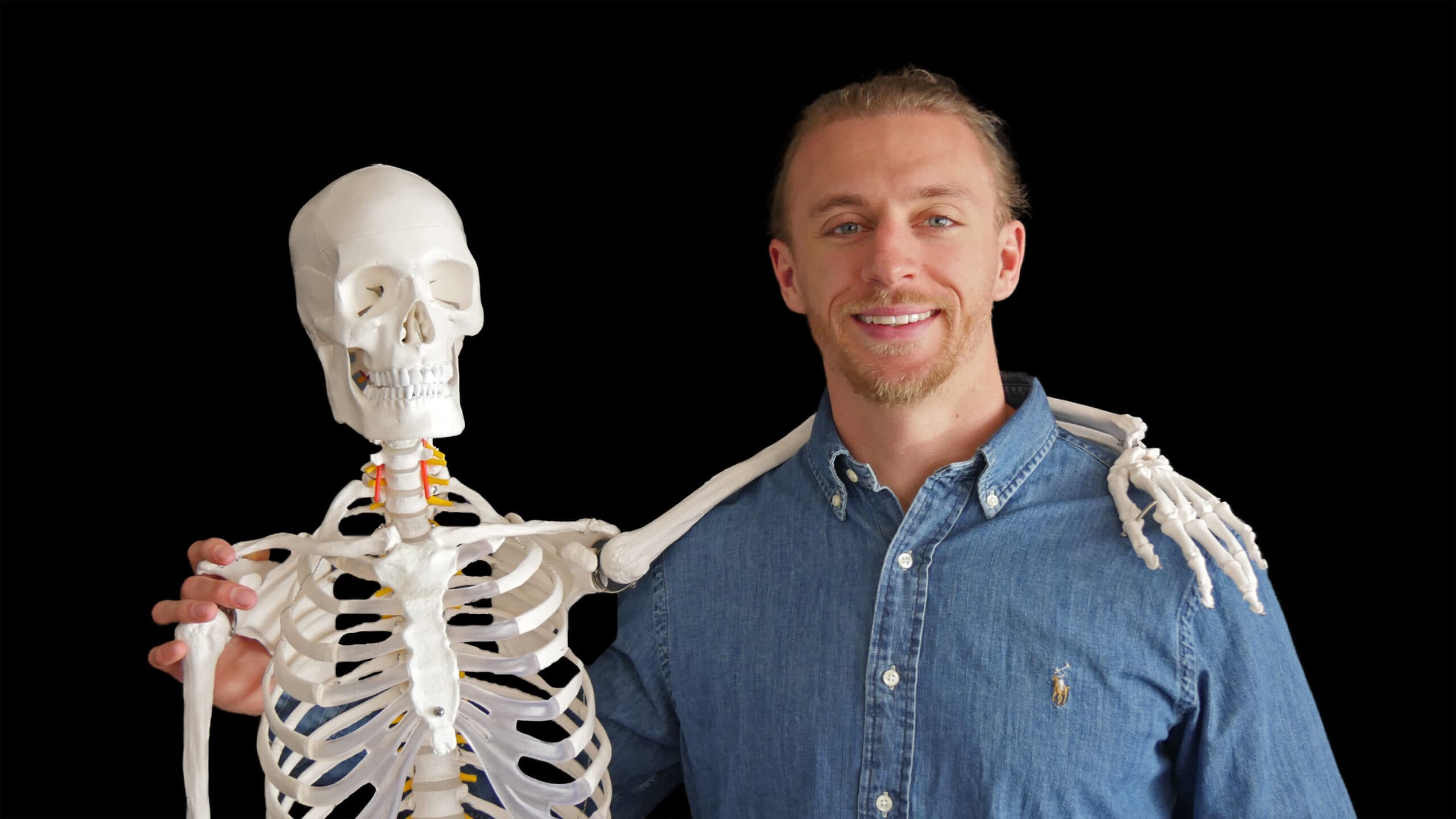Dr. Alexander Duff with an anatomy model — Terry Chiropractic Boulder